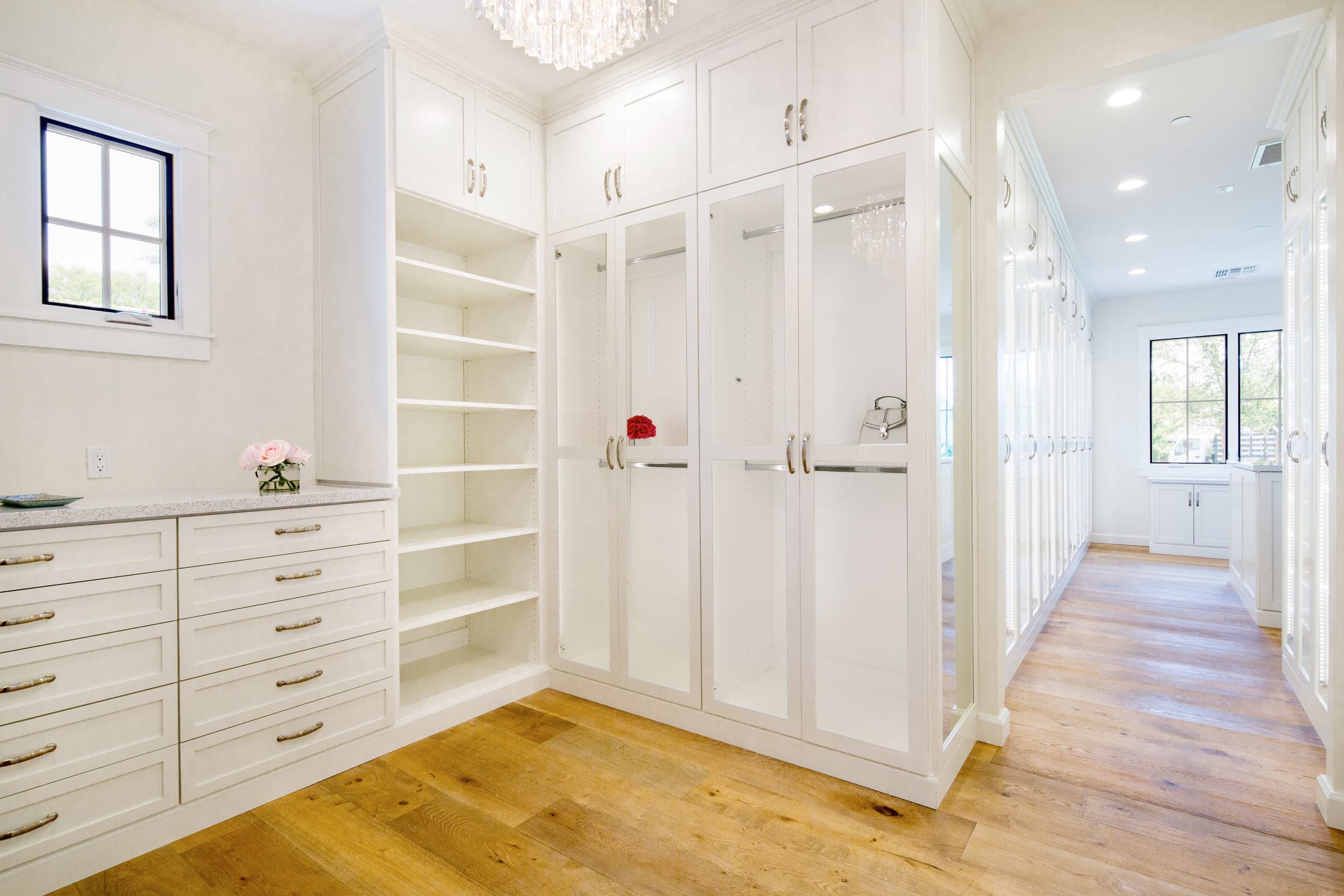A finished custom walk-in closet by Classy Closets in San Diego